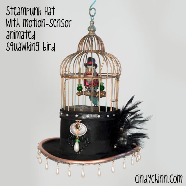 Steampunk hat with birdcage and animated bird